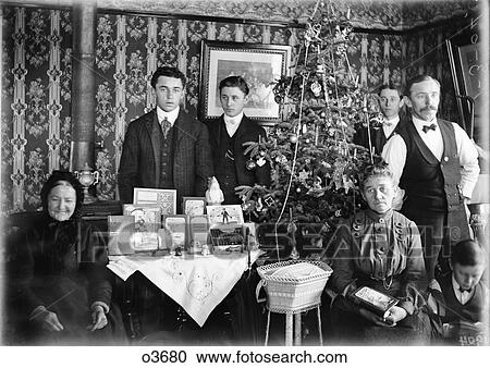 1890 1890S Turn Of Century Group Portrait Family Three Generations Posing By Christmas Tree Gifts On Table View Large Photo Image Stock Image - 1890 1890S Turn Of Century Group Portrait Family Three Generations Posing By Christmas Tree Gifts On Table . Fotosearch
