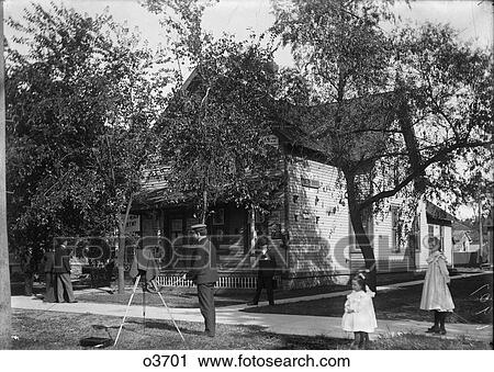 Stock Image - 1890 1890S Turn Of Century Man Photographing Building With Large Format Camera . Fotosearch