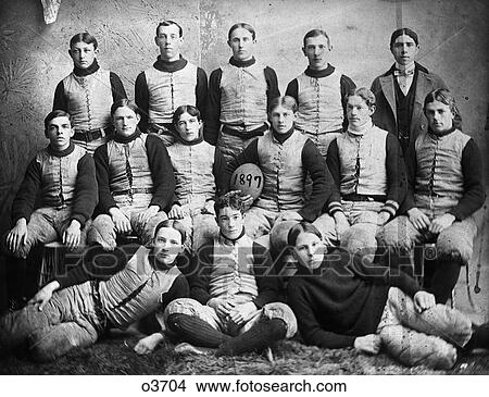 1890s 1897 TURN OF 20TH CENTURY GROUP PORTRAIT HIGH SCHOOL FOOTBALL TEAM PLAYERS WEARING TEAM UNIFORMS LOOKING AT CAMERA View Large Photo Image Picture - 1890s 1897 TURN OF 20TH CENTURY GROUP PORTRAIT HIGH SCHOOL FOOTBALL TEAM PLAYERS WEARING TEAM UNIFORMS LOOKING AT CAMERA. Fotosearch