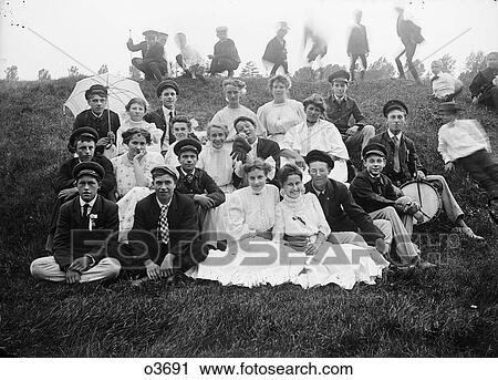 1890S Turn Of 20 Century Group Portrait Boys Girls Adolescents Sitting On Lawn Looking At Camera View Large Photo Image Stock Image - 1890S Turn Of 20 Century Group Portrait Boys Girls Adolescents Sitting On Lawn Looking At Camera . Fotosearch