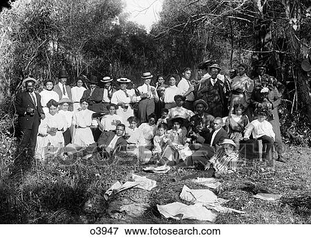 1890S Turn Of Century Group Portrait On Lawn African American Children Adults Family Some Drinking Wine Beer View Large Photo Image Stock Photo - 1890S Turn Of Century Group Portrait On Lawn African American Children Adults Family Some Drinking Wine Beer. Fotosearch