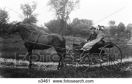 1890S Turn Of The 20Th Century Couple Man Woman Riding In Horse Drawn Buggy Carriage Looking At Camera View Large Photo Image Stock Image - 1890S Turn Of The 20Th Century Couple Man Woman Riding In Horse Drawn Buggy Carriage Looking At Camera . Fotosearch