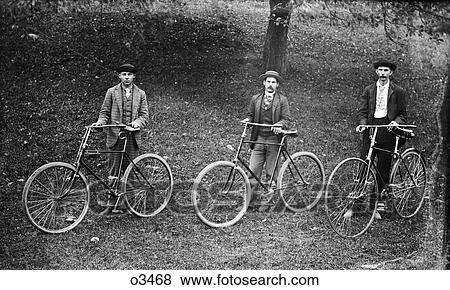 1900 1900S Three Turn Of The 20Th Century Men Posing Standing By Bicycles Looking At Camera View Large Photo Image Stock Photo - 1900 1900S Three Turn Of The 20Th Century Men Posing Standing By Bicycles Looking At Camera . Fotosearch