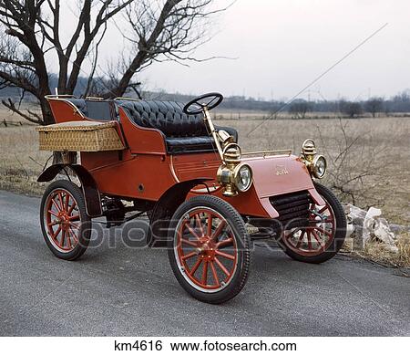 1903 RED FORD MODEL A AUTOMOBILE WITH BLACK LEATHER SEATS RED WOOD SPOKE WHEELS WOVEN WICKER SIDE BASKETS BRASS HORN AND LAMPS View Large Photo Image Stock Photograph - 1903 RED FORD MODEL A AUTOMOBILE WITH BLACK LEATHER SEATS RED WOOD SPOKE WHEELS WOVEN WICKER SIDE BASKETS BRASS HORN AND LAMPS. Fotosearch