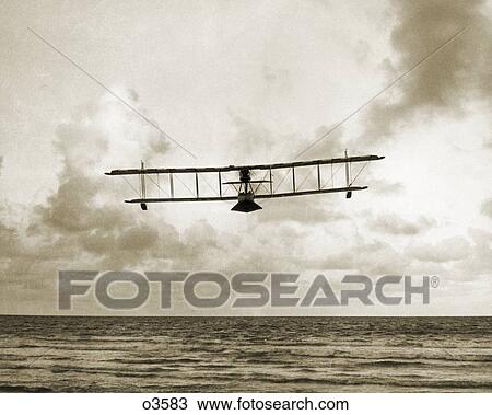 1910s EARLY WALSH BROTHERS WORLD WAR ONE BIPLANE SEAPLANE PILOT TRAINING FLYING BOAT OVER THE OCEAN OUTDOOR NEW ZEALAND View Large Photo Image Stock Image - 1910s EARLY WALSH BROTHERS WORLD WAR ONE BIPLANE SEAPLANE PILOT TRAINING FLYING BOAT OVER THE OCEAN OUTDOOR NEW ZEALAND. Fotosearch