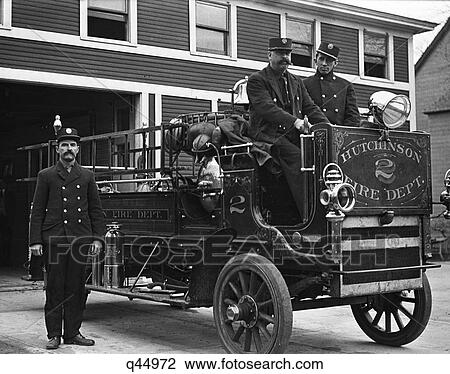 1910S Fire Station Firemen Sitting On And Standing Beside Fire Engine Truck Looking At Camera View Large Photo Image Stock Image - 1910S Fire Station Firemen Sitting On And Standing Beside Fire Engine Truck Looking At Camera. Fotosearch