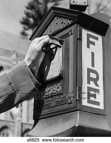 1920S 1930S 1940S 1950S Male Hand Pulling Lever On Street Fire Alarm Box View Large Photo Image Stock Photography - 1920S 1930S 1940S 1950S Male Hand Pulling Lever On Street Fire Alarm Box . Fotosearch