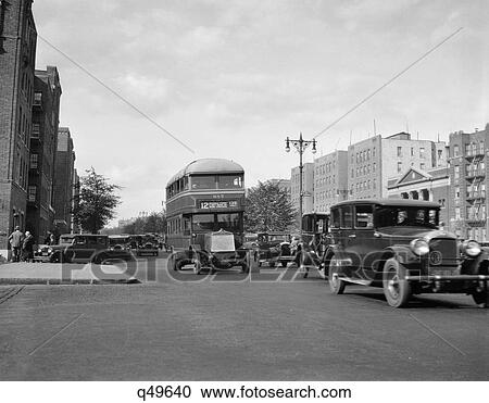 1920s 1930s DOUBLE DECKER BUS AND CARS IN TRAFFIC ON THE GRAND CONCOURSE IN THE BRONX NEW YORK CITY USA View Large Photo Image Stock Image - 1920s 1930s DOUBLE DECKER BUS AND CARS IN TRAFFIC ON THE GRAND CONCOURSE IN THE BRONX NEW YORK CITY USA. Fotosearch