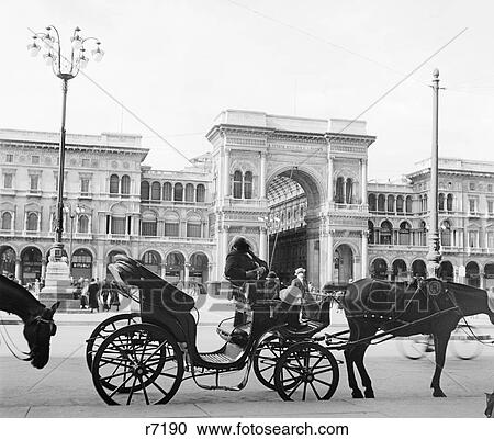 1920s 1930s HORSE AND CARRIAGE AWAITING TOURISTS FARMERS SHOPPING ARCADE GALLERIA VITTORIO EMMANUEL MILAN ITALY View Large Photo Image Stock Image - 1920s 1930s HORSE AND CARRIAGE AWAITING TOURISTS FARMERS SHOPPING ARCADE GALLERIA VITTORIO EMMANUEL MILAN ITALY. Fotosearch