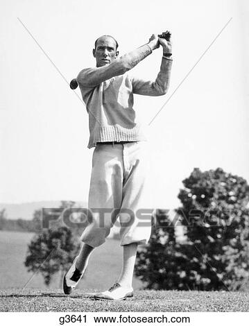 1920s 1930s MAN GOLFER WEARING KNICKERS AND SWEATER SWINGING DRIVER CLUB View Large Photo Image Stock Image - 1920s 1930s MAN GOLFER WEARING KNICKERS AND SWEATER SWINGING DRIVER CLUB. Fotosearch
