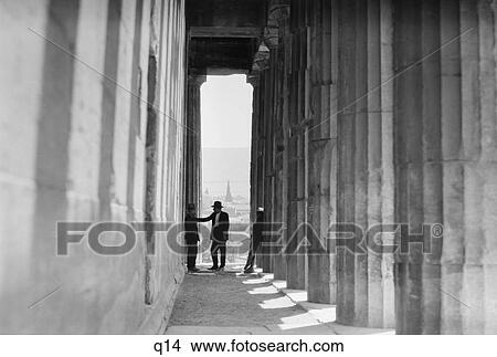 1920S 1930S Three Men Standing In Column Lined Passageway Temple Of Hephaestus Athens Greece View Large Photo Image Picture - 1920S 1930S Three Men Standing In Column Lined Passageway Temple Of Hephaestus Athens Greece. Fotosearch