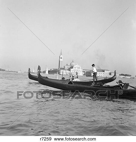 1920s 1930s TWO GONDOLAS IN THE LAGOON VENICE ITALY View Large Photo Image Stock Photo - 1920s 1930s TWO GONDOLAS IN THE LAGOON VENICE ITALY. Fotosearch