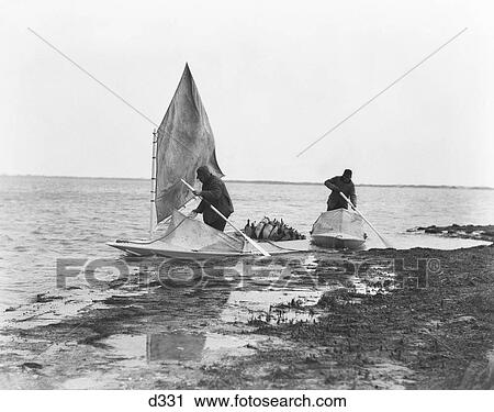 1920s 1930s TWO MEN IN SNEAKBOX BOATS FILLED WITH DUCK DECOYS IN MARSHES PREPARING TO DUCK HUNT BARNEGAT BAY NEW JERSEY USA View Large Photo Image Stock Image - 1920s 1930s TWO MEN IN SNEAKBOX BOATS FILLED WITH DUCK DECOYS IN MARSHES PREPARING TO DUCK HUNT BARNEGAT BAY NEW JERSEY USA. Fotosearch