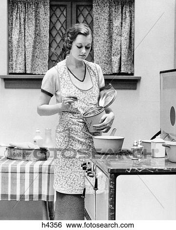 1920s 1930s WOMAN IN KITCHEN WORKING COOKING ON STOVE View Large Photo Image Stock Photograph - 1920s 1930s WOMAN IN KITCHEN WORKING COOKING ON STOVE. Fotosearch