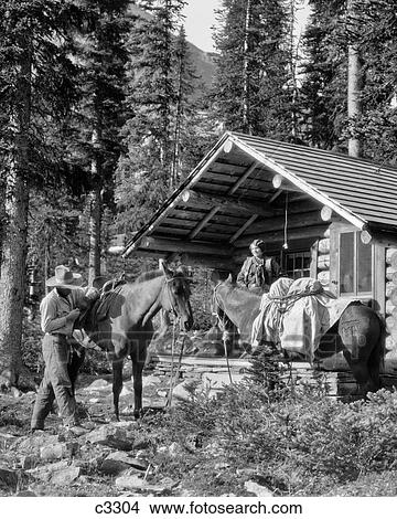 1920s CAMPING WOMAN STANDING PORCH LOG CABIN MAN PUTTING SADDLE ON HORSE LAKE O'HARA BRITISH COLUMBIA CANADA View Large Photo Image Picture - 1920s CAMPING WOMAN STANDING PORCH LOG CABIN MAN PUTTING SADDLE ON HORSE LAKE O'HARA BRITISH COLUMBIA CANADA. Fotosearch