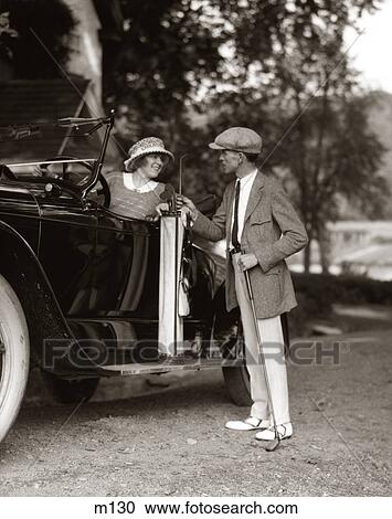 1920s COUPLE WOMAN MAN RESTING GOLF CLUBS BAG ON 1922 LINCOLN CONVERTIBLE RUNNING BOARD UPSCALE COUNTRY CLUB GOLFING LIFESTYLE View Large Photo Image Stock Image - 1920s COUPLE WOMAN MAN RESTING GOLF CLUBS BAG ON 1922 LINCOLN CONVERTIBLE RUNNING BOARD UPSCALE COUNTRY CLUB GOLFING LIFESTYLE. Fotosearch