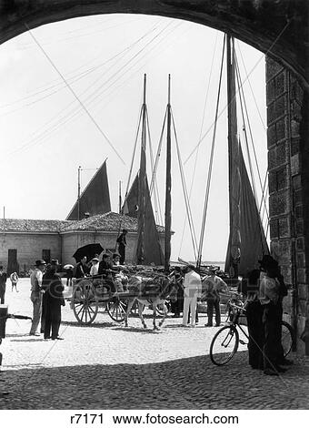 1920s LAKEFRONT WITH BOATS FISHERMEN PEDESTRIANS HORSE CARRIAGE DESENZANO LAKE GARDA ITALY View Large Photo Image Stock Image - 1920s LAKEFRONT WITH BOATS FISHERMEN PEDESTRIANS HORSE CARRIAGE DESENZANO LAKE GARDA ITALY. Fotosearch