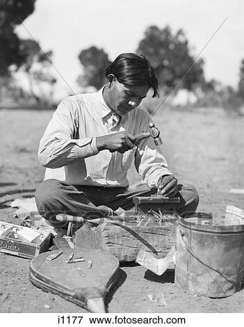 1920S Native American Indian Navajo Man Silversmith Craftsman Making Traditional Jewelry New Mexico Usa View Large Photo Image Stock Photo - 1920S Native American Indian Navajo Man Silversmith Craftsman Making Traditional Jewelry New Mexico Usa. Fotosearch