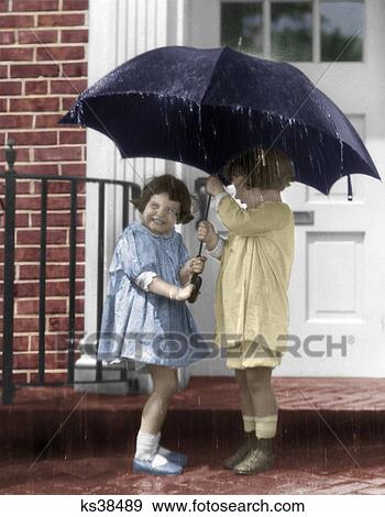1920S Pair Of Little Girls Standing On Front Stoop Under Umbrella In Pouring Rain View Large Photo Image Stock Photo - 1920S Pair Of Little Girls Standing On Front Stoop Under Umbrella In Pouring Rain. Fotosearch