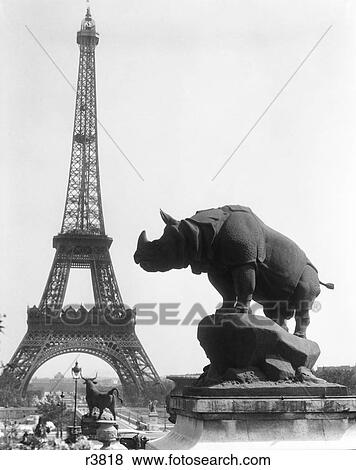 1920S Rhinoceros Statue In Foreground Eiffel Tower In Background Paris France View Large Photo Image Stock Photo - 1920S Rhinoceros Statue In Foreground Eiffel Tower In Background Paris France. Fotosearch