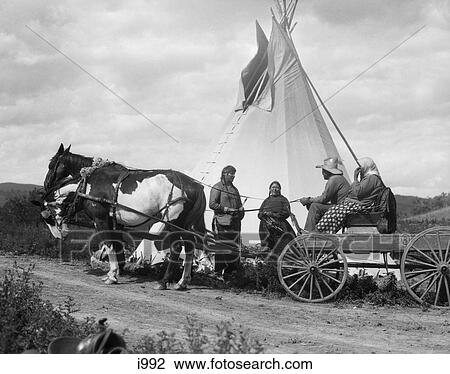 1920S Two Native American Indian Couples Visiting By Tepee One Couple In Horse And Wagon Stoney Sioux Tribe Ablerta Canada View Large Photo Image Stock Image - 1920S Two Native American Indian Couples Visiting By Tepee One Couple In Horse And Wagon Stoney Sioux Tribe Ablerta Canada. Fotosearch