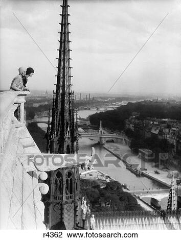 1920S Two Women Looking Out From Top Of Notre Dame Cathedral Paris France View Large Photo Image Stock Image - 1920S Two Women Looking Out From Top Of Notre Dame Cathedral Paris France . Fotosearch