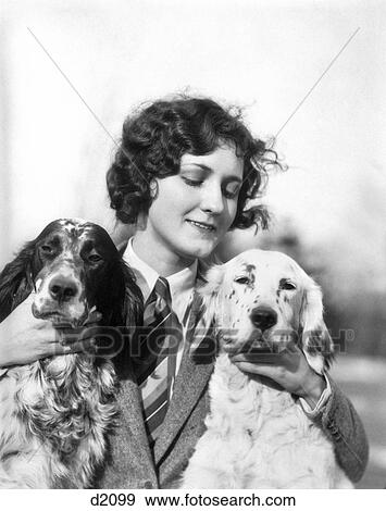 1920s WOMAN HOLDING PETTING TWO ENGLISH SETTER DOGS OUTDOORS View Large Photo Image Stock Photo - 1920s WOMAN HOLDING PETTING TWO ENGLISH SETTER DOGS OUTDOORS. Fotosearch