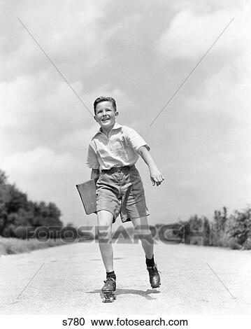 1930s 1930s SMILING BOY ROLLER SKATING TO SCHOOL LOOKING AT CAMERA CARRYING TEXTBOOK BINDER View Large Photo Image Stock Image - 1930s 1930s SMILING BOY ROLLER SKATING TO SCHOOL LOOKING AT CAMERA CARRYING TEXTBOOK BINDER. Fotosearch