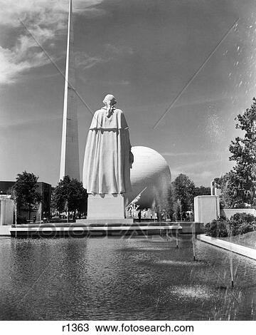 1930s 1939 WORLD'S FAIR CONSTITUTION MALL POND SURROUNDED BY STATUES TRYLON AND PERISPHERE IN BACKGROUND NEW YORK CITY NY USA View Large Photo Image Stock Image - 1930s 1939 WORLD'S FAIR CONSTITUTION MALL POND SURROUNDED BY STATUES TRYLON AND PERISPHERE IN BACKGROUND NEW YORK CITY NY USA. Fotosearch