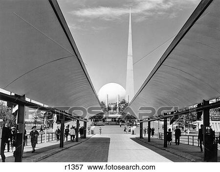 1930s 1939 WORLDS FAIR SIDEWALK OF THEME CENTER LOOKING TO TRYLON AND PERISPHERE NEW YORK CITY USA View Large Photo Image Stock Photo - 1930s 1939 WORLDS FAIR SIDEWALK OF THEME CENTER LOOKING TO TRYLON AND PERISPHERE NEW YORK CITY USA. Fotosearch
