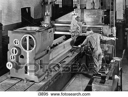 1930s 1940s 1950s MAN WORKING WITH HEAVY MACHINERY IN MANUFACTURING FACTORY View Large Photo Image Stock Photography - 1930s 1940s 1950s MAN WORKING WITH HEAVY MACHINERY IN MANUFACTURING FACTORY. Fotosearch