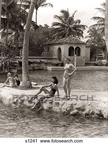 1930s 1940s 2 WOMEN BATHING SUITS SANDALS BY EDGE OF VENETIAN POOL CORAL GABLES FLORIDA View Large Photo Image Stock Image - 1930s 1940s 2 WOMEN BATHING SUITS SANDALS BY EDGE OF VENETIAN POOL CORAL GABLES FLORIDA. Fotosearch