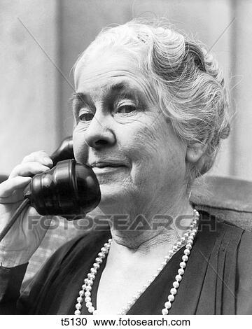 1930s 1940s OLD WOMAN ON TELEPHONE HEAD AND SHOULDERS GRAY HAIR PEARLS LOOKING AT CAMERA View Large Photo Image Stock Image - 1930s 1940s OLD WOMAN ON TELEPHONE HEAD AND SHOULDERS GRAY HAIR PEARLS LOOKING AT CAMERA. Fotosearch