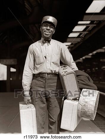 1930s 1940s SMILING AFRICAN AMERICAN MAN RAILROAD PASSENGER TRAIN RED CAP PORTER CARRYING LUGGAGE & SUITCASES LOOKING AT CAMERA View Large Photo Image Stock Image - 1930s 1940s SMILING AFRICAN AMERICAN MAN RAILROAD PASSENGER TRAIN RED CAP PORTER CARRYING LUGGAGE & SUITCASES LOOKING AT CAMERA. Fotosearch