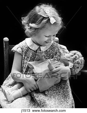 1930s 1940s SMILING BLOND GIRL HOLDING BABY DOLL View Large Photo Image Stock Image - 1930s 1940s SMILING BLOND GIRL HOLDING BABY DOLL. Fotosearch