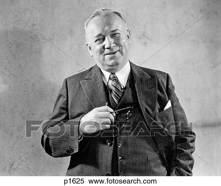 1930s 1940s SMILING SENIOR MAN BUSINESS SUIT VEST TIE LOOKING AT CAMERA HOLDING A PIPE View Large Photo Image Stock Photography - 1930s 1940s SMILING SENIOR MAN BUSINESS SUIT VEST TIE LOOKING AT CAMERA HOLDING A PIPE. Fotosearch