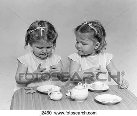 1930S 1940S Twin Girls Having Tea Party Toy Dishes Cups Table View Large Photo Image Stock Image - 1930S 1940S Twin Girls Having Tea Party Toy Dishes Cups Table. Fotosearch