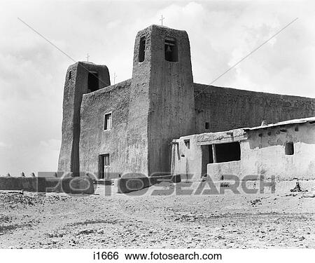 Stock Photograph - 1930S Adobe Building Architecture Church Towers Of Mission San Estaban Rey Acoma Pueblo New Mexico Usa. Fotosearch