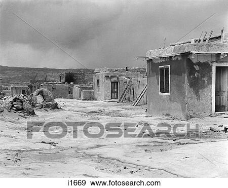 1930s ADOBE BUILDINGS AND BREAD BAKING OVENS ARCHITECTURE OF ACOMA PUEBLO NEW MEXICO USA View Large Photo Image Stock Photo - 1930s ADOBE BUILDINGS AND BREAD BAKING OVENS ARCHITECTURE OF ACOMA PUEBLO NEW MEXICO USA. Fotosearch