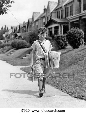 1930s BOY NEWSBOY LOOKING AT CAMERA DELIVERING NEWSPAPERS WALKING ALONG SUBURBAN STREET OF ROW HOUSES View Large Photo Image Stock Image - 1930s BOY NEWSBOY LOOKING AT CAMERA DELIVERING NEWSPAPERS WALKING ALONG SUBURBAN STREET OF ROW HOUSES. Fotosearch