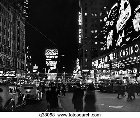 1930s BROADWAY LOOKING NORTH FROM 44TH TIMES SQUARE AT NIGHT MIDTOWN MANHATTAN NEW YORK CITY USA View Large Photo Image Stock Photo - 1930s BROADWAY LOOKING NORTH FROM 44TH TIMES SQUARE AT NIGHT MIDTOWN MANHATTAN NEW YORK CITY USA. Fotosearch
