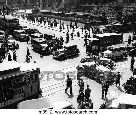 1930S Busy Intersection Fifth Avenue And 42Nd Street With Traffic Jam & Many Pedestrians New York City Usa View Large Photo Image Stock Image - 1930S Busy Intersection Fifth Avenue And 42Nd Street With Traffic Jam & Many Pedestrians New York City Usa. Fotosearch