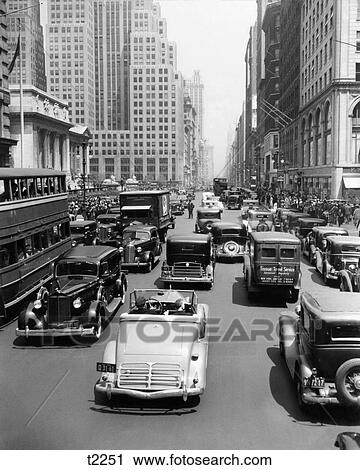1930s CARS TRUCKS DOUBLE DECKER BUSES STREET TRAFFIC 5TH AVENUE TRAFFIC BY PUBLIC LIBRARY MANHATTAN NEW YORK CITY USA View Large Photo Image Stock Image - 1930s CARS TRUCKS DOUBLE DECKER BUSES STREET TRAFFIC 5TH AVENUE TRAFFIC BY PUBLIC LIBRARY MANHATTAN NEW YORK CITY USA. Fotosearch