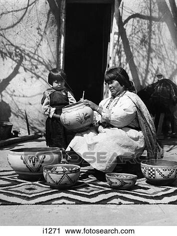1930S Child Watching Native American Indian Woman Artist Decorating Pottery Cochiti Pueblo New Mexico Usa View Large Photo Image Stock Image - 1930S Child Watching Native American Indian Woman Artist Decorating Pottery Cochiti Pueblo New Mexico Usa. Fotosearch