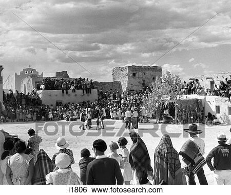 1930s CROWD OF NATIVE AMERICAN INDIAN PEOPLE GATHERED FOR CORN DANCE AND FIESTA AT LAGUNA PUEBLO NEW MEXICO USA View Large Photo Image Stock Photograph - 1930s CROWD OF NATIVE AMERICAN INDIAN PEOPLE GATHERED FOR CORN DANCE AND FIESTA AT LAGUNA PUEBLO NEW MEXICO USA. Fotosearch