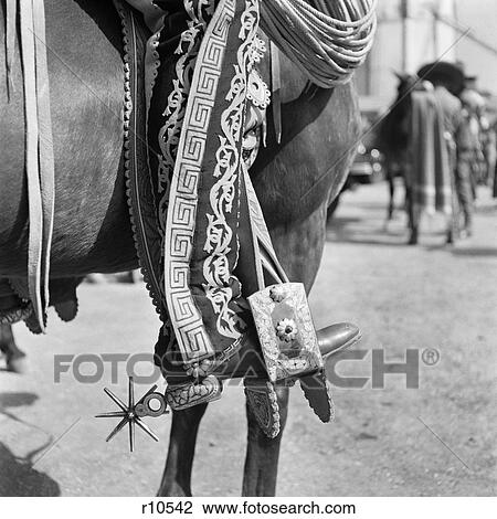 1930S Detail Of Traditional Charro Cowboy Costume Embroidered Chaps Spurs Leather Boots In Horses Stirrup Mexico View Large Photo Image Stock Image - 1930S Detail Of Traditional Charro Cowboy Costume Embroidered Chaps Spurs Leather Boots In Horses Stirrup Mexico. Fotosearch