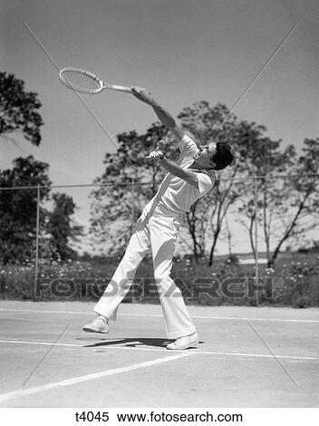 1930s MAN PLAYING TENNIS SWINGING RACKET View Large Photo Image Stock Photography - 1930s MAN PLAYING TENNIS SWINGING RACKET. Fotosearch