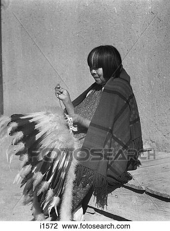 1930S Native American Indian Woman Sewing Feathered Headdress War Bonnet San Ildefonso Pueblo New Mexico Usa View Large Photo Image Stock Image - 1930S Native American Indian Woman Sewing Feathered Headdress War Bonnet San Ildefonso Pueblo New Mexico Usa. Fotosearch