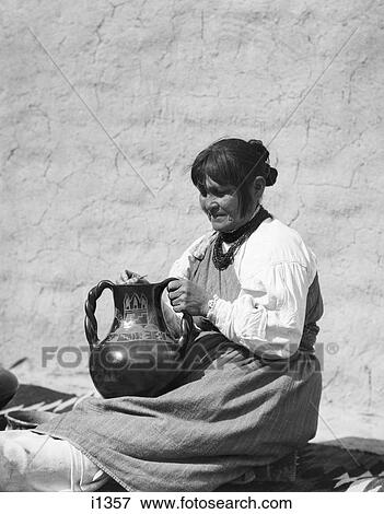 1930S Native American Indian Woman Polishing Piece Of Pottery Santa Clara Pueblo New Mexico Usa View Large Photo Image Stock Photo - 1930S Native American Indian Woman Polishing Piece Of Pottery Santa Clara Pueblo New Mexico Usa. Fotosearch