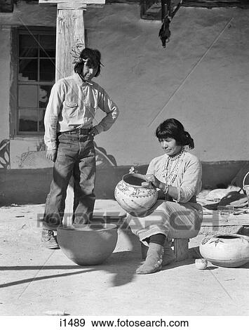 1930s NATIVE AMERICAN MAN AND WOMAN DECORATING POTTERY COCHITI PUEBLO NEW MEXICO USA View Large Photo Image Stock Photo - 1930s NATIVE AMERICAN MAN AND WOMAN DECORATING POTTERY COCHITI PUEBLO NEW MEXICO USA. Fotosearch